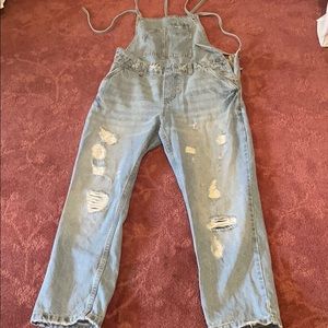 Denim overalls with ripped detailing